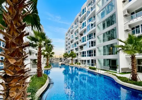 1 Bedroom Condo for Sale at Grand Avenue Residence resort-style lagoon pool surrounded by palm trees