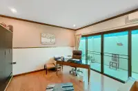 3 Bedroom House for Sale in Na Kluea home office with wooden desk, chair and sliding glass doors
