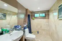 3 Bedroom House for Sale in Na Kluea bathroom with mosaic tile shower and vanity sink