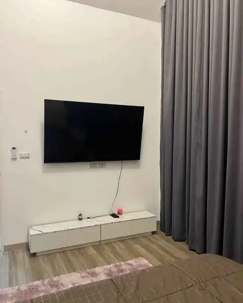 3 Bedroom House for Rent in Na Kluea bedroom featuring wall-mounted TV and marble-top media console