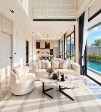 4 Bedroom House for Sale in Na Kluea open-plan living room with pool view through floor-to-ceiling windows