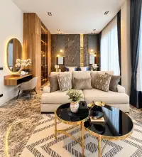 4 Bedroom House for Sale in Na Kluea bedroom lounge area with marble accent wall and vanity mirror