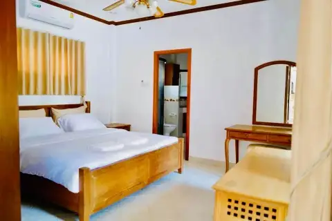 4 Bedroom House for Rent at Nirvana Pool Villa 1 bedroom with wooden bed, air conditioning and ensuite bathroom