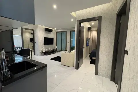 2 Bedroom Condo for Sale at Zenith Pattaya open-plan layout with kitchen counter, hallway, and bedroom entrance