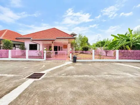 2 Bedroom House for Rent at Noen Plub Wan Village exterior view with pink fence and tiled roof