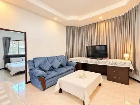 2 Bedroom House for Rent at Noen Plub Wan Village cozy living area with TV console and blue sofa