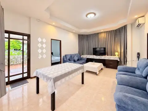 2 Bedroom House for Rent at Noen Plub Wan Village living room with sliding door access to patio