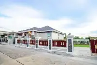 3 Bedroom House for Sale & Rent in Nong Pla Lai exterior view with decorative gated perimeter wall and driveway