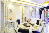 3 Bedroom House for Sale & Rent in Nong Pla Lai elegant dining area with marble accent wall and chandelier