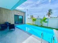 3 Bedroom House for Rent in Nong Pla Lai private pool with lounge seating and poolside patio view