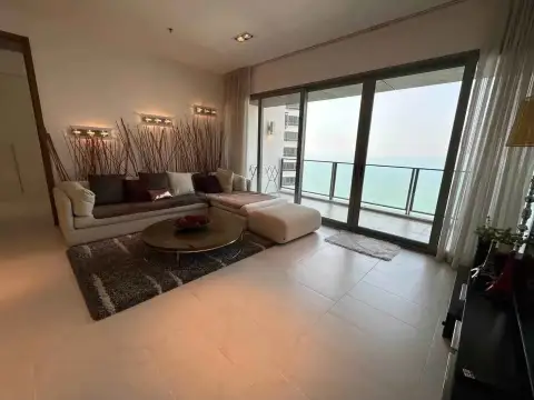2 Bedroom Condo for Rent at Northpoint living area with sectional sofa and private balcony overlooking the ocean