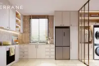 4 Bedroom House for Sale at Patta Terrane modern kitchen with cream cabinets, tile backsplash, stainless fridge and laundry room