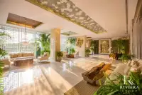 1 Bedroom Condo for Sale in The Riviera Wongamat living room with sofa and TV