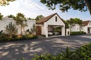 Mirama Pattaya house exterior with double garage, white barn-style facade, and lush tropical landscaping