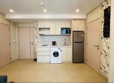 2 Bedroom Condo for Rent at Olympus City Garden kitchen with washing machine, fridge and built-in cabinets