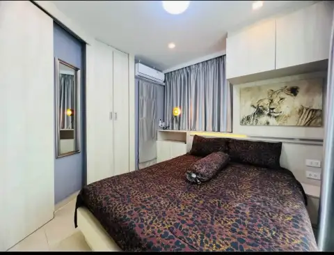 2 Bedroom Condo for Rent at Olympus City Garden bedroom view with wardrobe, mirror and bed