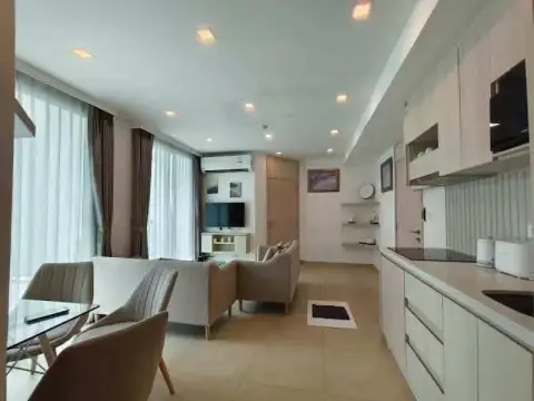 2 Bedroom Condo for Rent at Olympus City Garden open-plan living area with dining table and kitchen counter