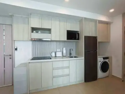2 Bedroom Condo for Rent at Olympus City Garden fitted kitchen with fridge, microwave and washing machine