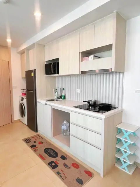 2 Bedroom Condo for Sale at Olympus City Garden fitted kitchen with built-in cabinets, stove and washing machine
