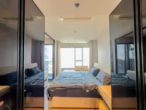 1 Bedroom Condo for Rent at Once Pattaya bedroom reflected in mirrored wardrobe doors with city view