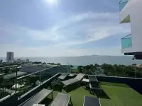 1 Bedroom Condo for Sale at One Tower Pratumnak rooftop sun deck with loungers and sea view