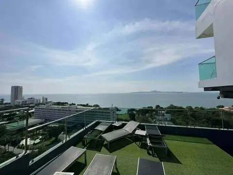 1 Bedroom Condo for Sale at One Tower Pratumnak rooftop sun deck with loungers and sea view