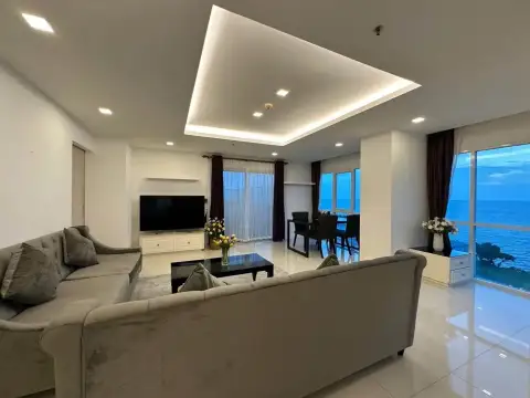 2 Bedroom Condo for Rent at One Tower Pratumnak spacious lounge with dining area and ocean view windows