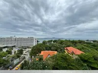 1 Bedroom Condo for Sale at One Tower Pratumnak aerial view of sea, hotel and tropical greenery from balcony