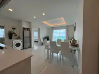 1 Bedroom Condo for Sale at One Tower Pratumnak open kitchen and dining area with sea view windows