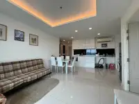 1 Bedroom Condo for Sale at One Tower Pratumnak living room with sofa, dining table and open kitchen