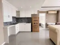 2 Bedroom Condo for Sale at The Orient Resort & Spa white kitchen with marble countertops and new refrigerator box