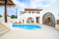 4 Bedroom House for Sale at The Sunshine House private pool with Santorini-style white facade, arched cabana lounge and thatched sala