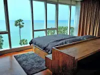 2 Bedroom Condo for Rent at Palm Wongamat bedroom with floor-to-ceiling windows and panoramic sea view
