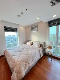 2 Bedroom Condo for Sale at Palm Wongamat master bedroom with wood flooring and city view windows