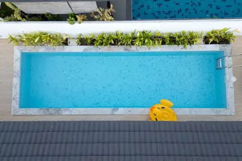 3 Bedroom House for Sale at Panalee Village aerial view of rectangular swimming pool with pool float