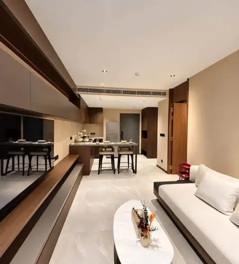 1 Bedroom Condo for Rent at Panora Estuaria living room with sofa, kitchen counter, and dining area