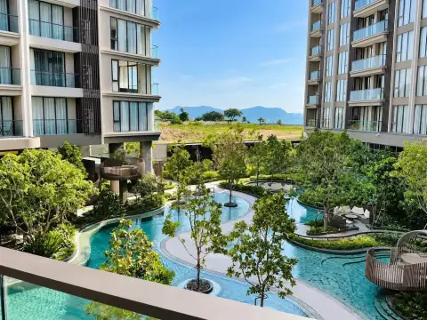 1 Bedroom Condo for Rent at Panora Estuaria balcony view of lagoon pool, gardens, and mountains