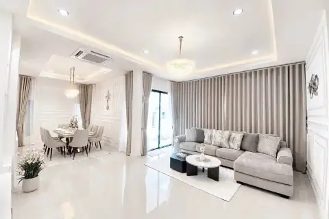 3 Bedroom House for Sale at Paradise Hill 2 open-plan living and dining space with gray sofa