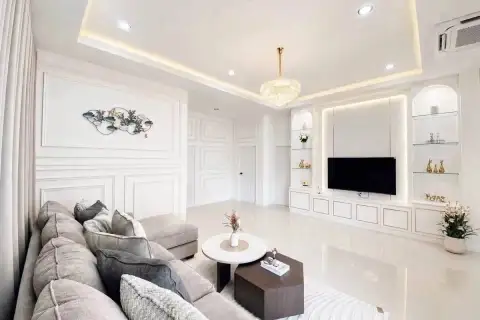 3 Bedroom House for Sale at Paradise Hill 2 lounge area with sofa, TV wall and wall art