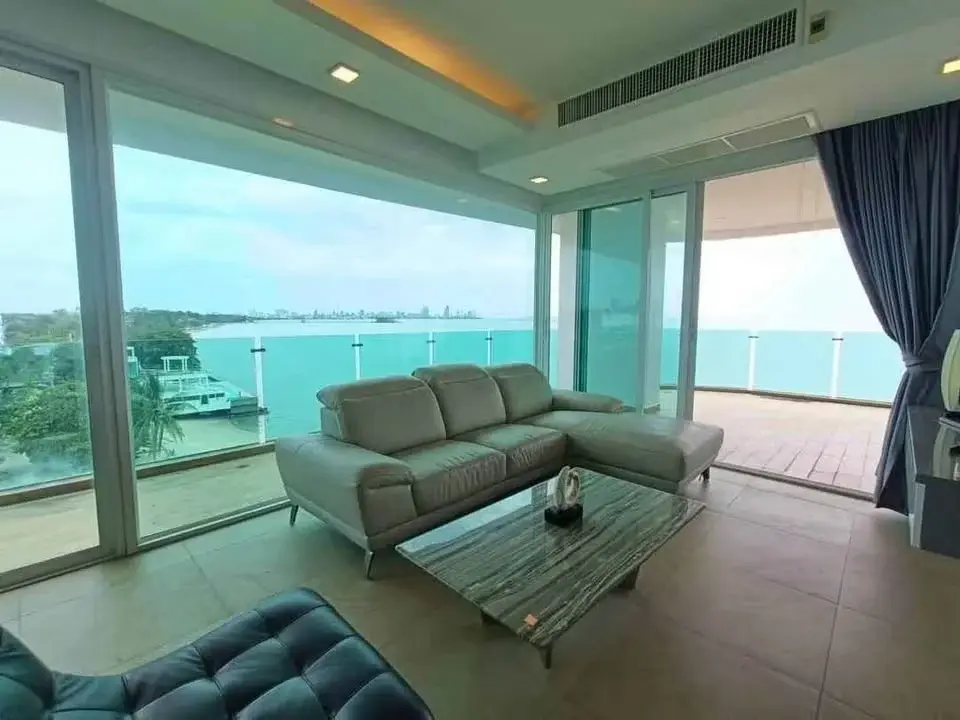 2 Bedroom Condo for Sale at Paradise Ocean View living room with sectional sofa and panoramic sea view balcony