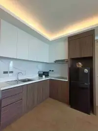 2 Bedroom Condo for Sale at Paradise Ocean View modern kitchen with marble backsplash and wood cabinetry