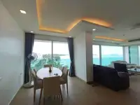 2 Bedroom Condo for Sale at Paradise Ocean View dining area and lounge with floor-to-ceiling windows overlooking the ocean