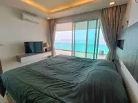 2 Bedroom Condo for Sale at Paradise Ocean View master bedroom with TV console and expansive ocean view terrace