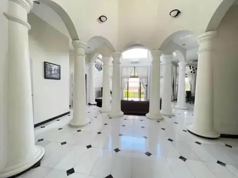 5 Bedroom House for Rent at Paradise Villa 1 & 2 colonnaded hallway with arched ceilings and marble flooring