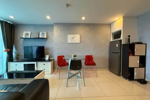 1 Bedroom Condo for Sale at Park Royal 3 dining area with red chairs, TV, and kitchen fridge