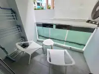 1 Bedroom Condo for Rent at Park Royal 3 private balcony with seating and drying rack