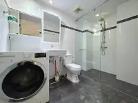 1 Bedroom Condo for Rent at Park Royal 3 bathroom with glass shower, toilet, sink and washing machine