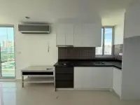 2 Bedroom Condo for Sale at Park Royal 3 kitchen with black countertops and white cabinetry