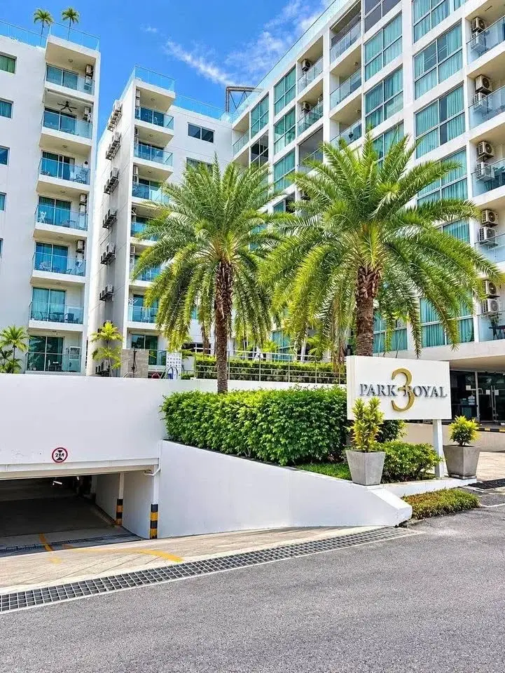 1 Bedroom Condo for Sale at Park Royal 3 building exterior with palm trees and entrance sign