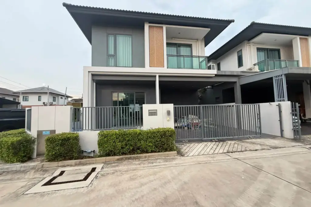 3 Bedroom House for Rent at Patta Define modern two-story home exterior with gated entrance and carport